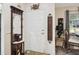 Inviting entryway showcasing decorative mirror, stylish table, and tasteful decor, setting a welcoming tone at 8158 Sturbridge Ct # D, Weeki Wachee, FL 34613