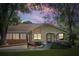 Charming single-story home featuring a well-manicured lawn and cozy front porch, perfect for relaxing evenings at 8158 Sturbridge Ct # D, Weeki Wachee, FL 34613