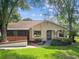 Inviting single-story home with mature landscaping and a well-maintained front yard at 8158 Sturbridge Ct # D, Weeki Wachee, FL 34613