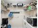 Walk-in pantry with shelving and storage for household items at 8158 Sturbridge Ct # D, Weeki Wachee, FL 34613