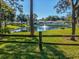 Relaxing pond view, framed by lush greenery and trees, offers a peaceful vista for community residents at 8158 Sturbridge Ct # D, Weeki Wachee, FL 34613