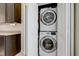 Convenient laundry closet with stacked washer and dryer at 8335 Crescent Moon Dr, New Port Richey, FL 34655