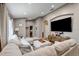 Spacious living room featuring hardwood flooring, neutral colored furniture and an entertainment center at 8335 Crescent Moon Dr, New Port Richey, FL 34655