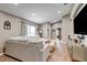 Spacious living room featuring hardwood flooring, neutral colored furniture and an entertainment center at 8335 Crescent Moon Dr, New Port Richey, FL 34655