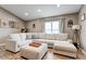 Bright living room featuring hardwood flooring, neutral colored furniture and a large window at 8335 Crescent Moon Dr, New Port Richey, FL 34655