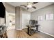 Office space features a ceiling fan, closet and large window at 8335 Crescent Moon Dr, New Port Richey, FL 34655