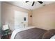 This bedroom offers neutral walls, a ceiling fan, and wood flooring at 8518 Quail Hollow Blvd, Wesley Chapel, FL 33544