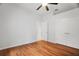 A spacious bedroom with hardwood floors and a large closet at 8518 Quail Hollow Blvd, Wesley Chapel, FL 33544