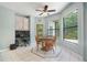 A cozy breakfast nook with large windows and an office space at 8518 Quail Hollow Blvd, Wesley Chapel, FL 33544