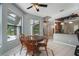Charming breakfast nook overlooking the pool and open to the kitchen at 8518 Quail Hollow Blvd, Wesley Chapel, FL 33544