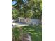 Spacious metal garage featuring a concrete pad and lawn area at 8518 Quail Hollow Blvd, Wesley Chapel, FL 33544