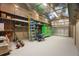 Garage interior equipped with shelves and a large tool chest, providing a functional and organized workspace at 8518 Quail Hollow Blvd, Wesley Chapel, FL 33544