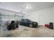 Spacious garage with car, lawnmower, and plenty of storage space at 8518 Quail Hollow Blvd, Wesley Chapel, FL 33544