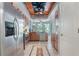 Spacious kitchen with stainless steel refrigerator and appliances, beautiful countertops, and ample cabinet space at 8518 Quail Hollow Blvd, Wesley Chapel, FL 33544