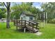 Play house in the backyard with slides and climbing area for children at 8518 Quail Hollow Blvd, Wesley Chapel, FL 33544