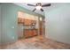 Spacious room featuring custom wood cabinetry and tiled floors at 8518 Quail Hollow Blvd, Wesley Chapel, FL 33544