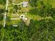 Overhead photo showcasing the home's location within a lush, green, wooded area at 8540 Roseanne Blvd, New Port Richey, FL 34654