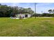 Spacious backyard featuring a patio with seating, perfect for outdoor entertaining at 8540 Roseanne Blvd, New Port Richey, FL 34654