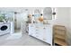 Stylish bathroom features a modern vanity with double sinks, and shower with stone pebble floor at 8540 Roseanne Blvd, New Port Richey, FL 34654