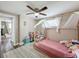 Charming bedroom with a bed frame draped in sheer white fabric, plush rugs, and bright lighting at 8540 Roseanne Blvd, New Port Richey, FL 34654