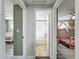 Hallway with view into the bathroom, Bedroom, and bedroom at 8540 Roseanne Blvd, New Port Richey, FL 34654