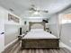 Spacious main bedroom featuring fan, neutral paint, and wood-look floors at 8540 Roseanne Blvd, New Port Richey, FL 34654