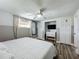 Nicely finished main bedroom with closet, wood-look floors, and white trim at 8540 Roseanne Blvd, New Port Richey, FL 34654
