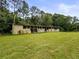 Rustic open shed with a spacious interior and multiple bays, perfect for storage or workshop at 8540 Roseanne Blvd, New Port Richey, FL 34654
