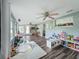Sun-filled playroom featuring wood-look floors, an abundance of natural light, and ample space at 8540 Roseanne Blvd, New Port Richey, FL 34654
