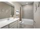 Bright bathroom featuring a tub, shower, modern vanity, a neutral color palette, and a calming design at 8921 Waxwing Way, Parrish, FL 34219