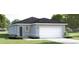 Charming single-story home with a two-car garage and beautifully landscaped front yard at 8921 Waxwing Way, Parrish, FL 34219