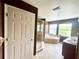 Bathroom featuring a glass shower, bathtub, and a double sink vanity with plenty of natural light from two windows at 930 Woodbridge Ct, Safety Harbor, FL 34695
