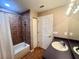 Well-lit bathroom featuring a shower/tub combination, a sink vanity, and tiled floor at 930 Woodbridge Ct, Safety Harbor, FL 34695
