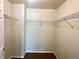 Spacious closet with multiple shelves for optimal organization and storage, and neutral walls at 930 Woodbridge Ct, Safety Harbor, FL 34695