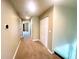 Neutral hallway with carpet, closet, and access to other rooms at 930 Woodbridge Ct, Safety Harbor, FL 34695