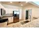Kitchen with granite countertops, a breakfast bar, stainless steel appliances, and white cabinets at 930 Woodbridge Ct, Safety Harbor, FL 34695