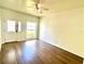 Entryway featuring wood floors, a door with decorative glass, and a front-facing window at 930 Woodbridge Ct, Safety Harbor, FL 34695