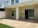 View of a patio with a sliding glass door leading to the home at 930 Woodbridge Ct, Safety Harbor, FL 34695