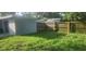 A look at the backyard including a shed, home and some fencing at 9432 84Th St, Seminole, FL 33777