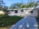 Charming single-story home with a well-maintained lawn and newly painted driveway at 9432 84Th St, Seminole, FL 33777