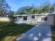 Charming single-story home with a well-maintained lawn and inviting curb appeal at 9432 84Th St, Seminole, FL 33777