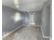 Bright living room featuring sleek gray flooring, neutral walls, and a ceiling fan at 9432 84Th St, Seminole, FL 33777