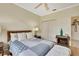 Cozy bedroom with wood floors, and a decorative electric fireplace at 10093 Holly Berry Dr, Weeki Wachee, FL 34613
