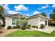Charming single-story home showcasing manicured landscaping and a welcoming front entrance on a sunny day at 10093 Holly Berry Dr, Weeki Wachee, FL 34613