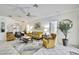 Spacious living room with an open layout, large windows, and elegant decor providing a comfortable ambiance at 10093 Holly Berry Dr, Weeki Wachee, FL 34613