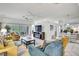 Bright living room featuring comfortable seating, a modern fireplace, and sliding glass doors to the outdoors at 10093 Holly Berry Dr, Weeki Wachee, FL 34613
