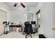 Bright home office featuring tile flooring, a window view, and a ceiling fan at 10093 Holly Berry Dr, Weeki Wachee, FL 34613