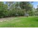 Expansive backyard offering a natural, serene setting with space for recreational activities at 10149 Rockbay Rd, Brooksville, FL 34601