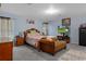 A spacious primary bedroom with soft, neutral carpet and a TV for relaxing at 10149 Rockbay Rd, Brooksville, FL 34601