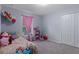 Cozy, carpeted bedroom with natural light from the window and a closet offers a comfortable and inviting space at 10149 Rockbay Rd, Brooksville, FL 34601